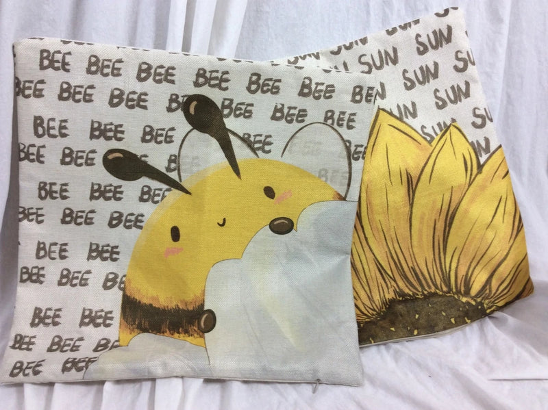 Burlap square pillowcase with yellow bee and sunflower print, stitched edges