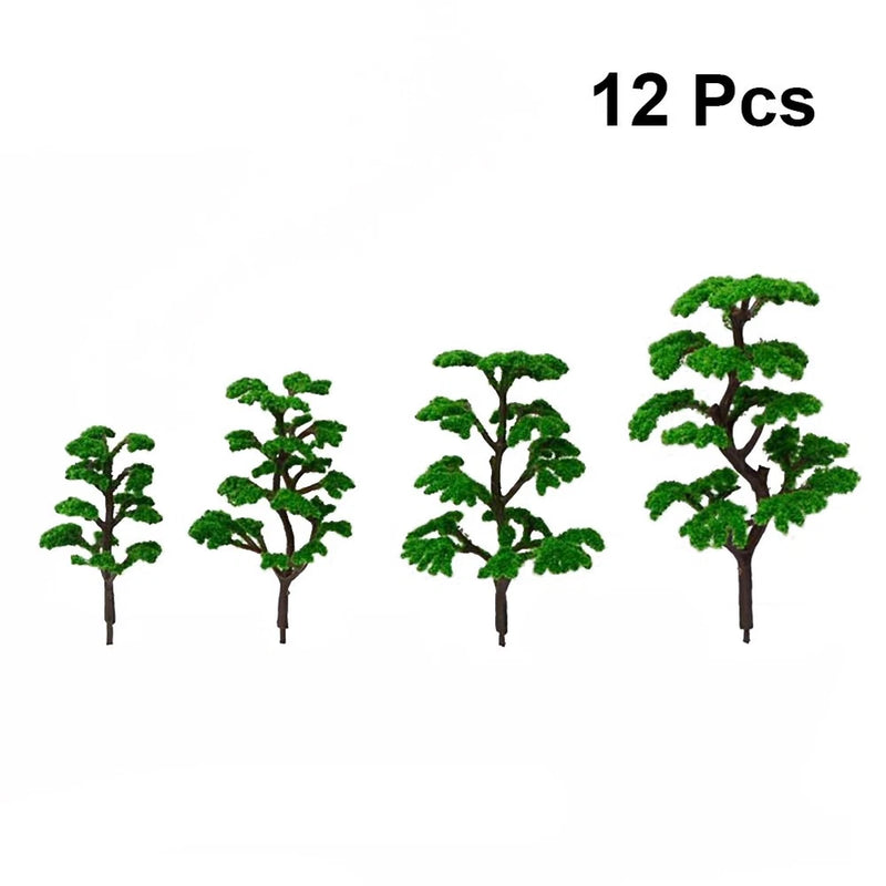 Set of 12 miniature model trees with green plastic foliage and brown trunks