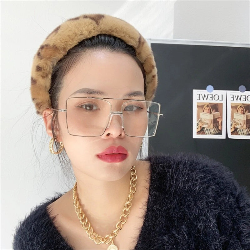 Tan rabbit fur headband with plush headband band around the forehead