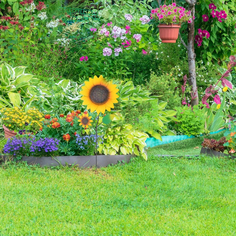 Metal sunflower garden stake sign with two bright yellow flower heads on stakes