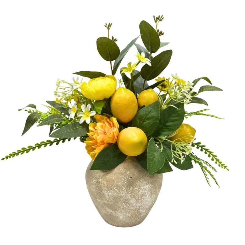 Artificial faux lemon plant in rustic grey vase with yellow lemons and green leaves