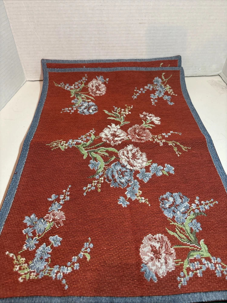 Red-brown vintage place mat with floral embroidery and denim-blue border