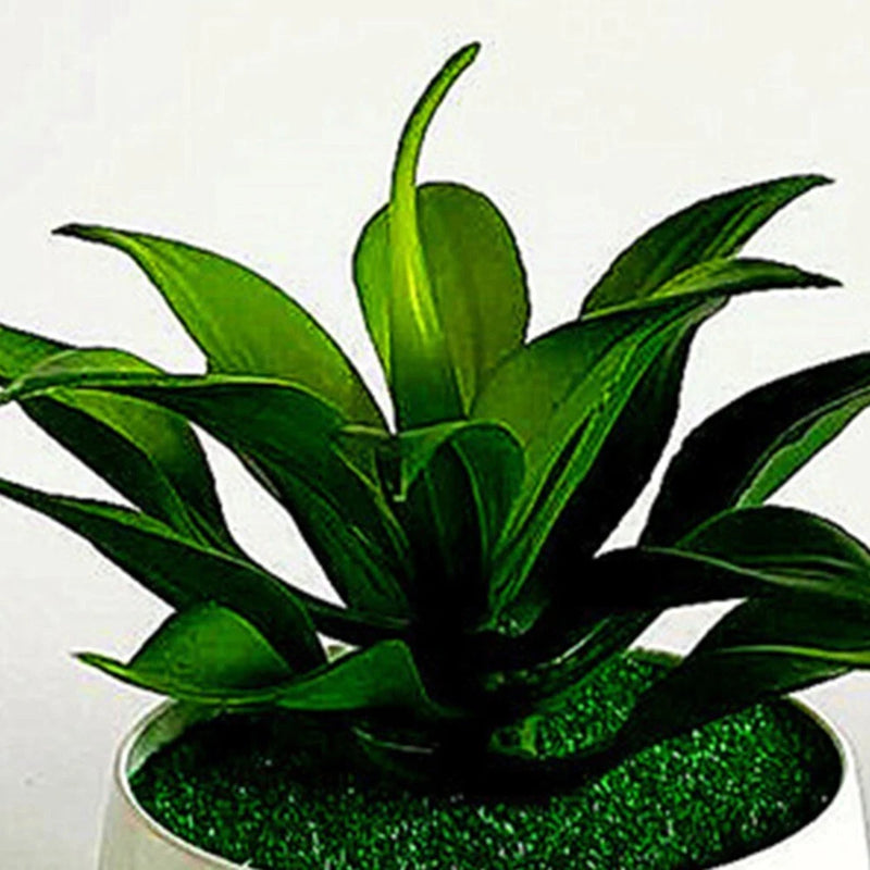 Artificial succulent plant with green leaves in dark speckled pot