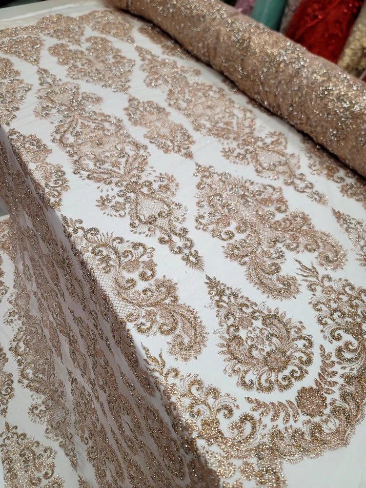 Rose gold glitter damask shimmer mesh fabric with ornate gold swirl pattern