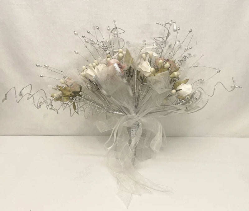 White bridal floral bouquet with pearl-like accents and silver wire stems