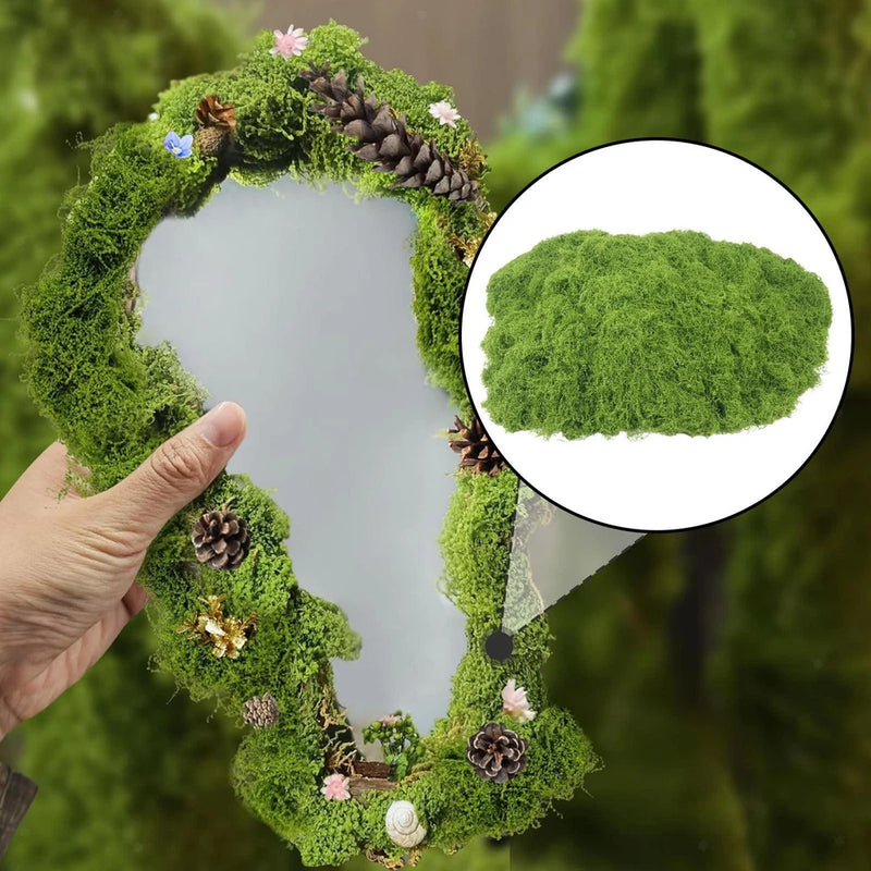 Artificial faux moss lichen wreath, dense bright green textured foliage with small pinecones.