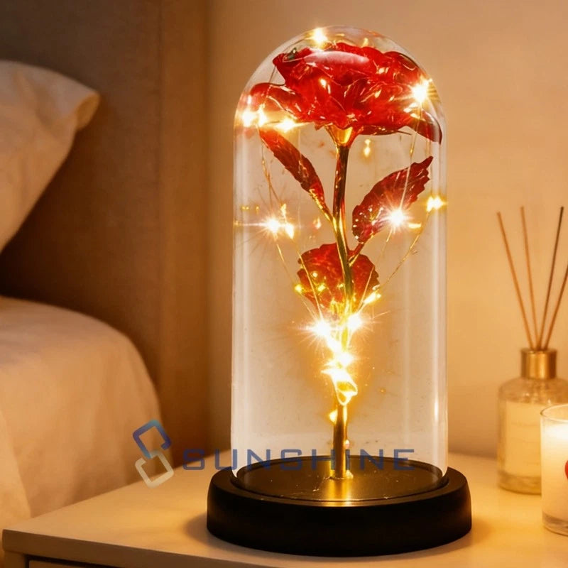 Glass dome rose gift with preserved red rose and warm LED lights on black base