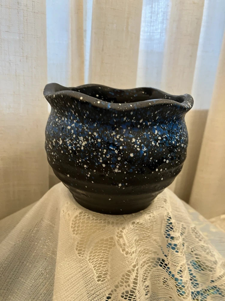 Starry Nights flower pot with black speckled finish and rounded scalloped rim