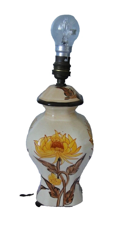 Sunflower ceramic table lamp with painted floral pattern and black base