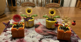 4- solar-powered FLOWERS IN POTS- 2-Sunflowers- 1-rose Colored 1-cream Colored. Sunflower