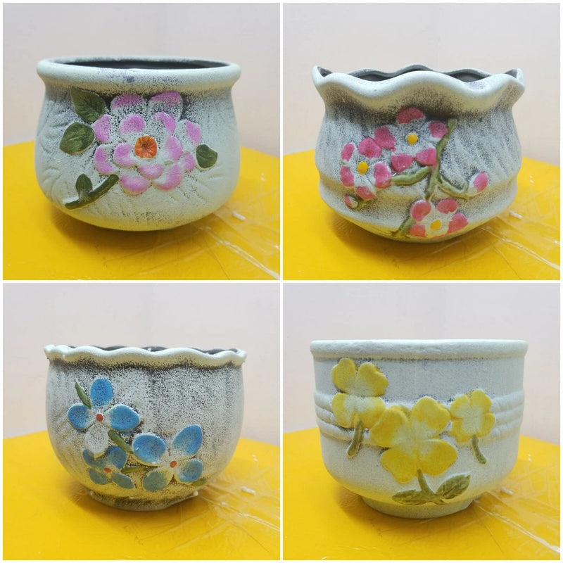 Set of 4 light blue round clay planter pots with colorful floral relief