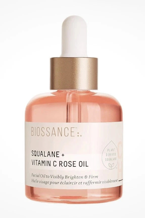 Biossance brightening facial serum bottle with rose oil, glass dropper top