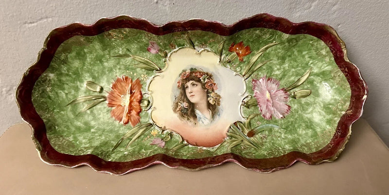 Antique floral portrait serving dish with scalloped red rim, green center