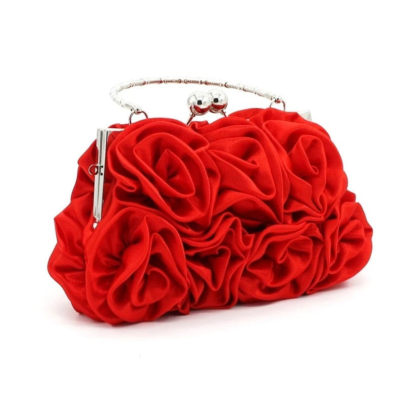 Red satin flower clutch bag with ruffled rosette design and silver clasp