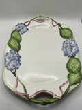 Vietri hand-painted blue hydrangea and green leaf design  pink ribbon accents Hydrangea
