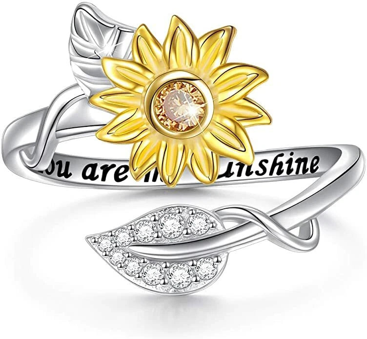 Sterling silver adjustable ring with gold sunflower and crystal center, heart band design