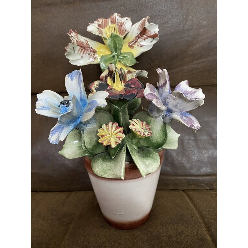 Capodimonte porcelain floral arrangement in white pot with blue and purple blossoms