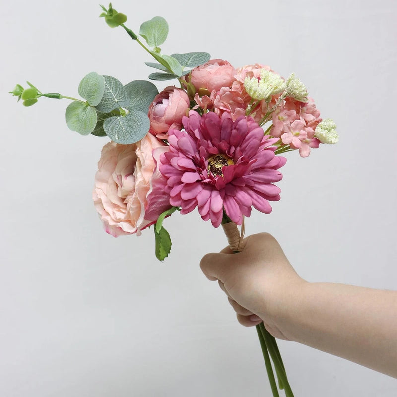 Artificial peony bouquet with mixed pink blooms and green leaves on stems
