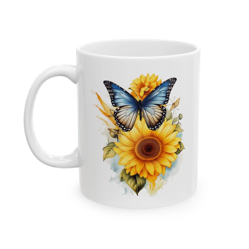 White ceramic mug with blue butterfly and sunflower floral graphic, left-side handle