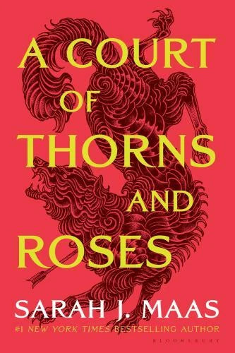 Red book cover with gold and maroon title text, ornate thorny rose graphic, Sarah J. Maas