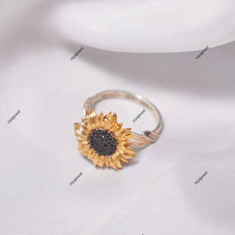 Sunflower ring with silver band, dark center, and gold-toned petals