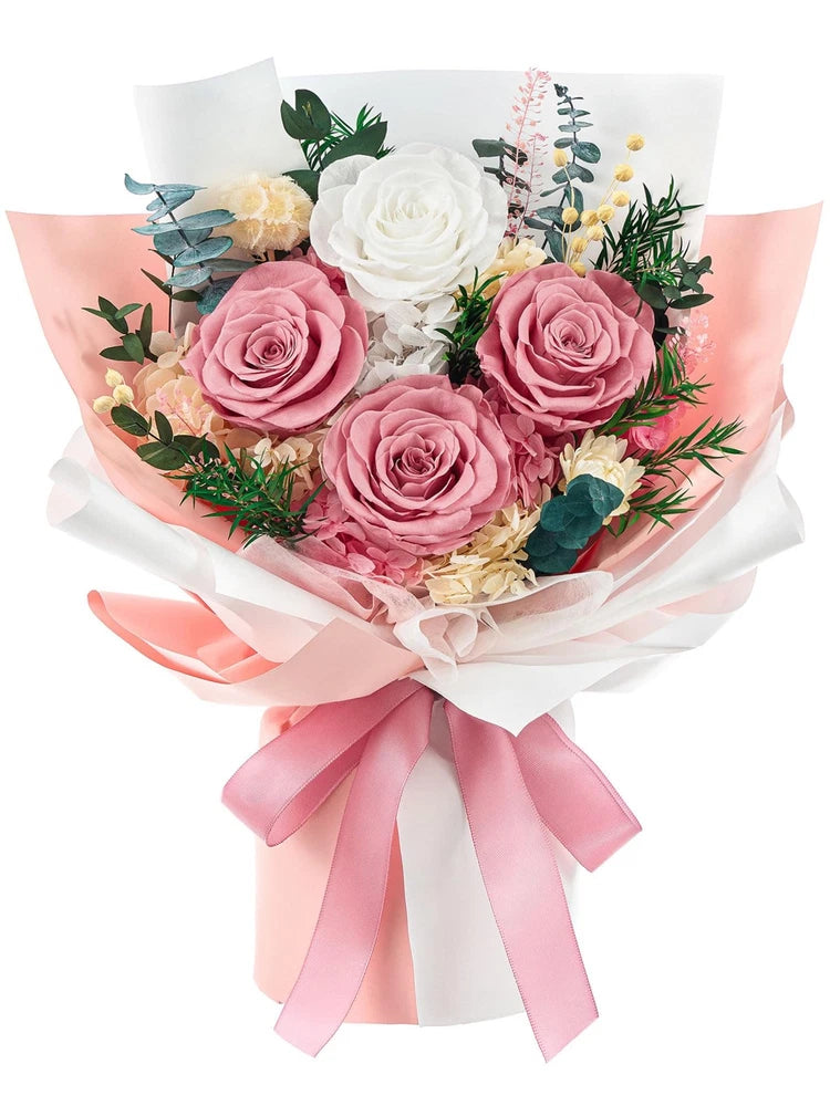 Preserved flower bouquet with pink and white roses, greenery, and layered pink ribbons