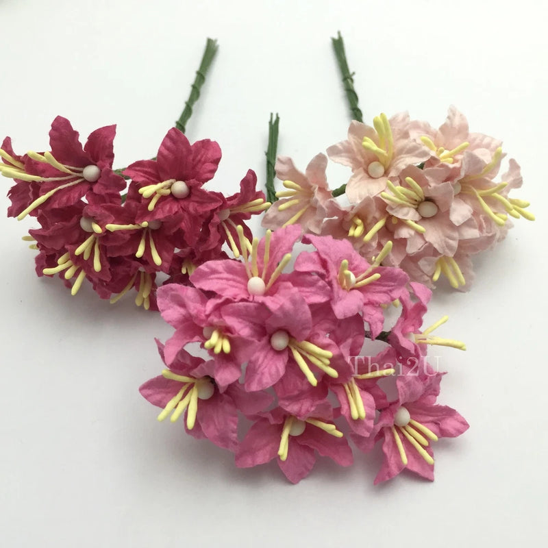 Pink and burgundy mini lily flower bundle with pale yellow stamens on green stems