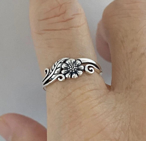 925 sterling silver sunflower ring with leaf, openwork design on finger