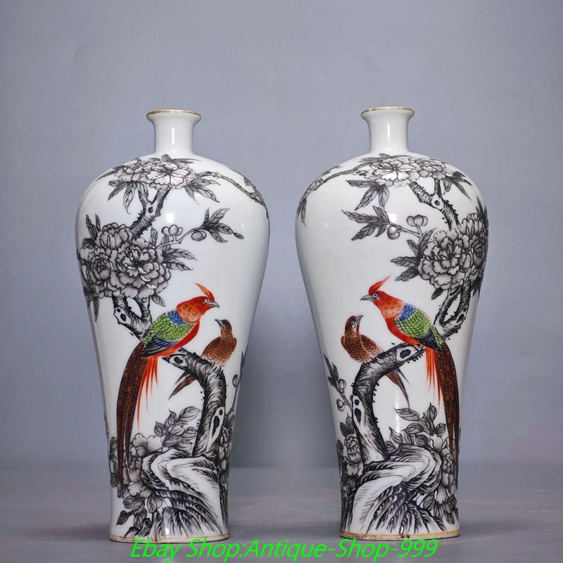 Pair of white porcelain bird-and-flower vases with black ink detailing and red-and-green accents