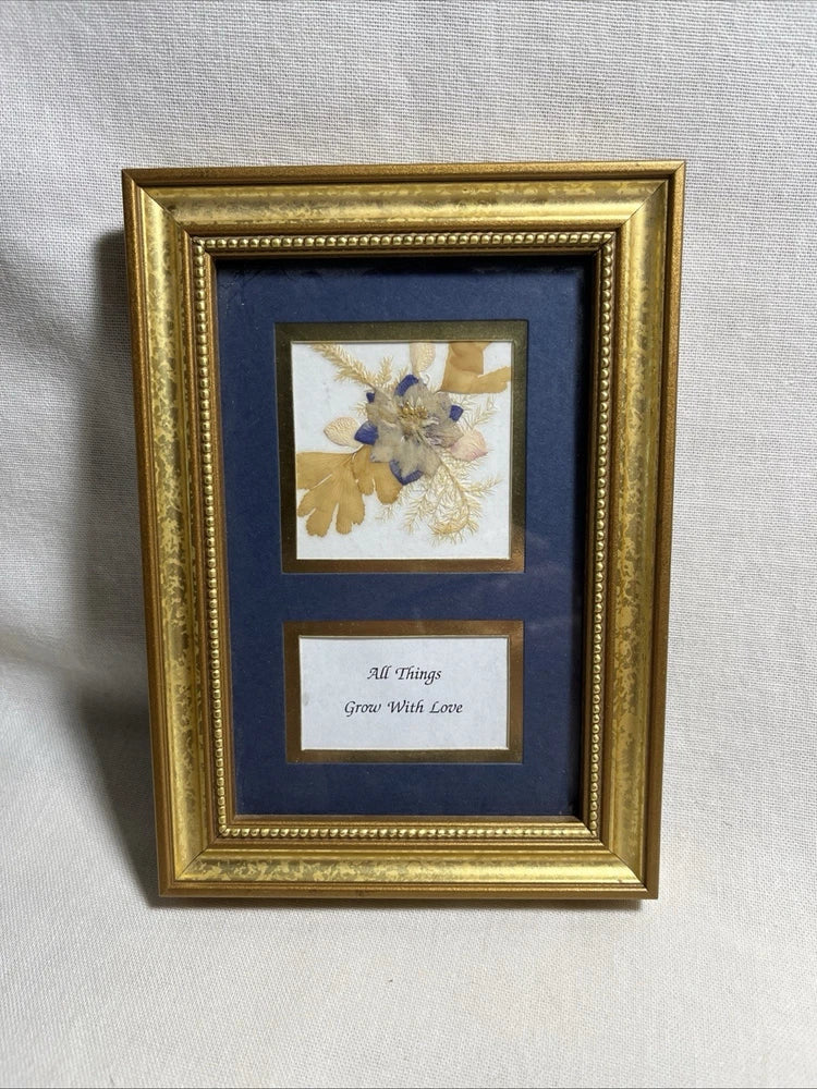 Gold wood framed dried flower print with blue mat and small floral and love text