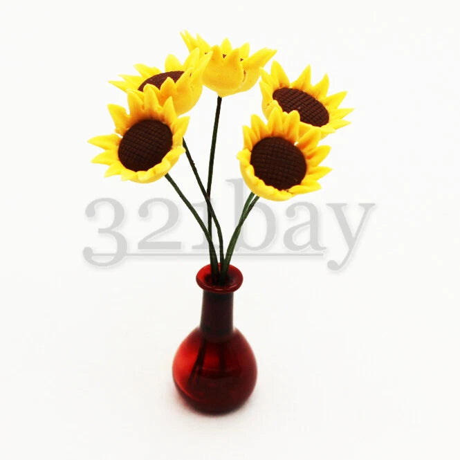 Miniature polymer sunflower bouquet in small red vase, three yellow blooms with dark centers