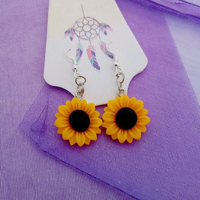 Yellow sunflower dangle earrings with textured flower petals and black center
