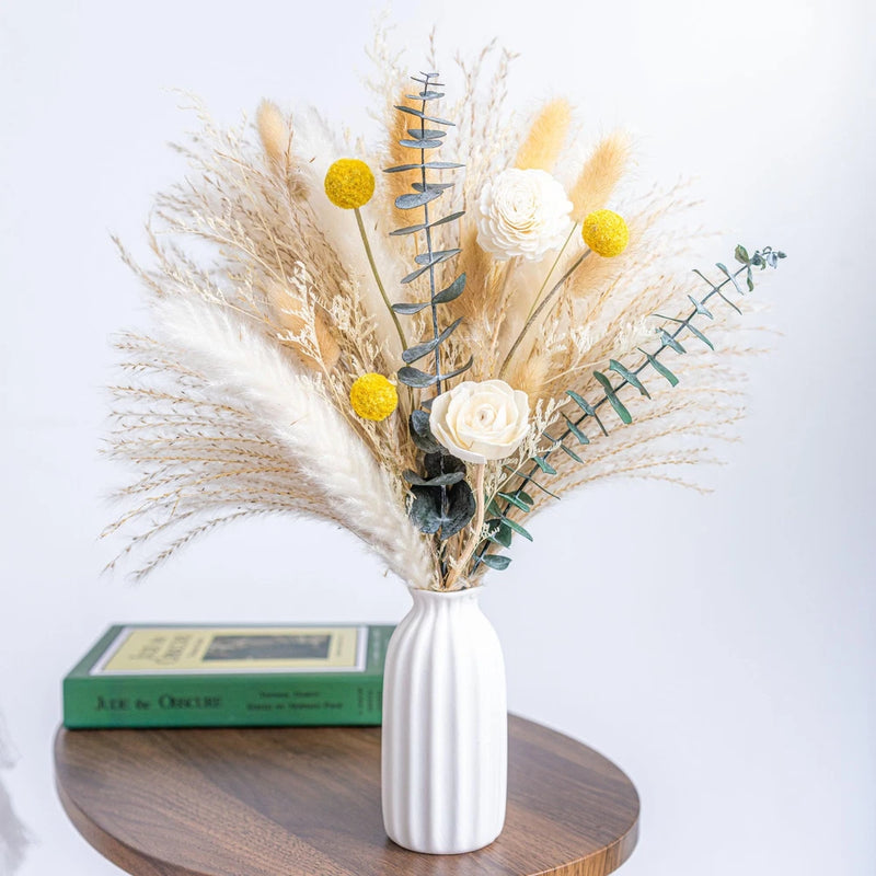 Ceramic vase reed diffuser with dried flower bouquet and wooden reeds