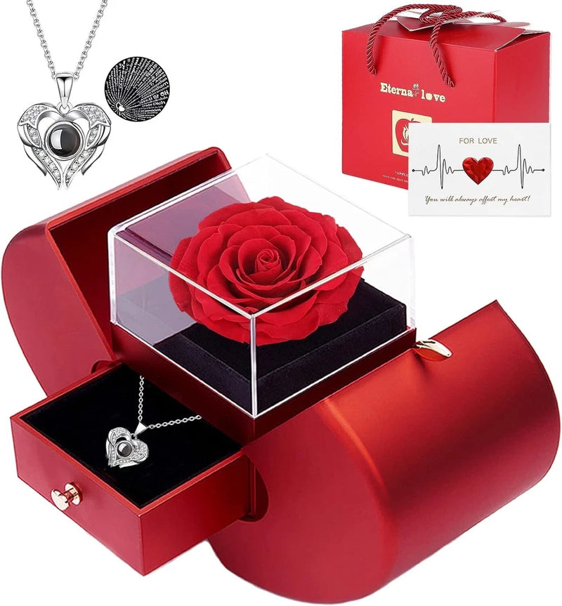 Red rose gift box with clear dome and heart necklace pendant on silver chain
