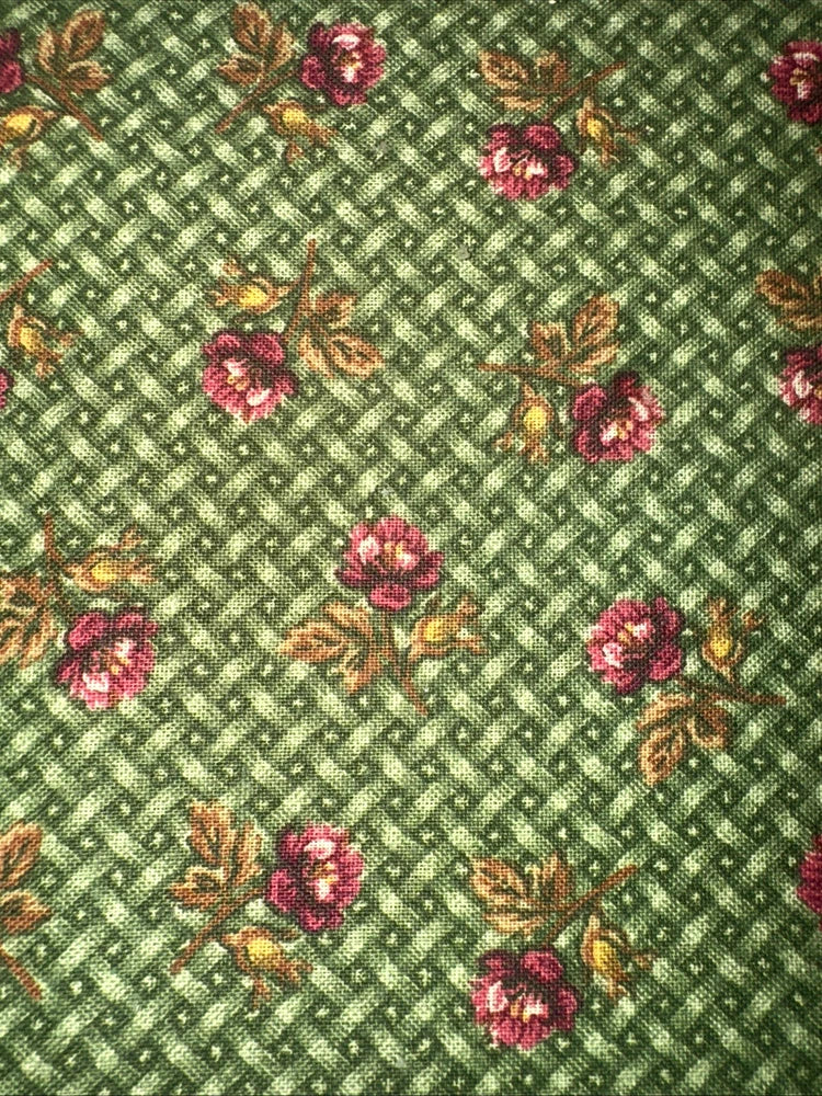 Green cotton fabric with red and pink rose flowers on diamond weave pattern