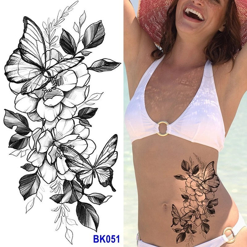 Peony and butterfly body temporary tattoo with black floral linework on upper abdomen
