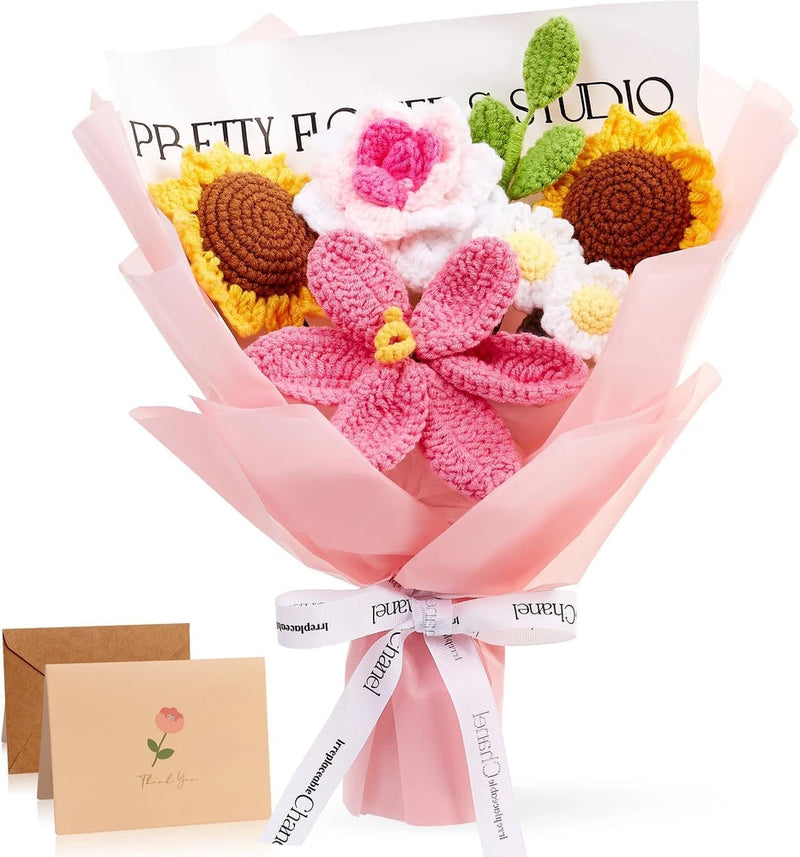 Handmade crochet flower bouquet with pink blossoms, yellow sunflowers, and green leaves