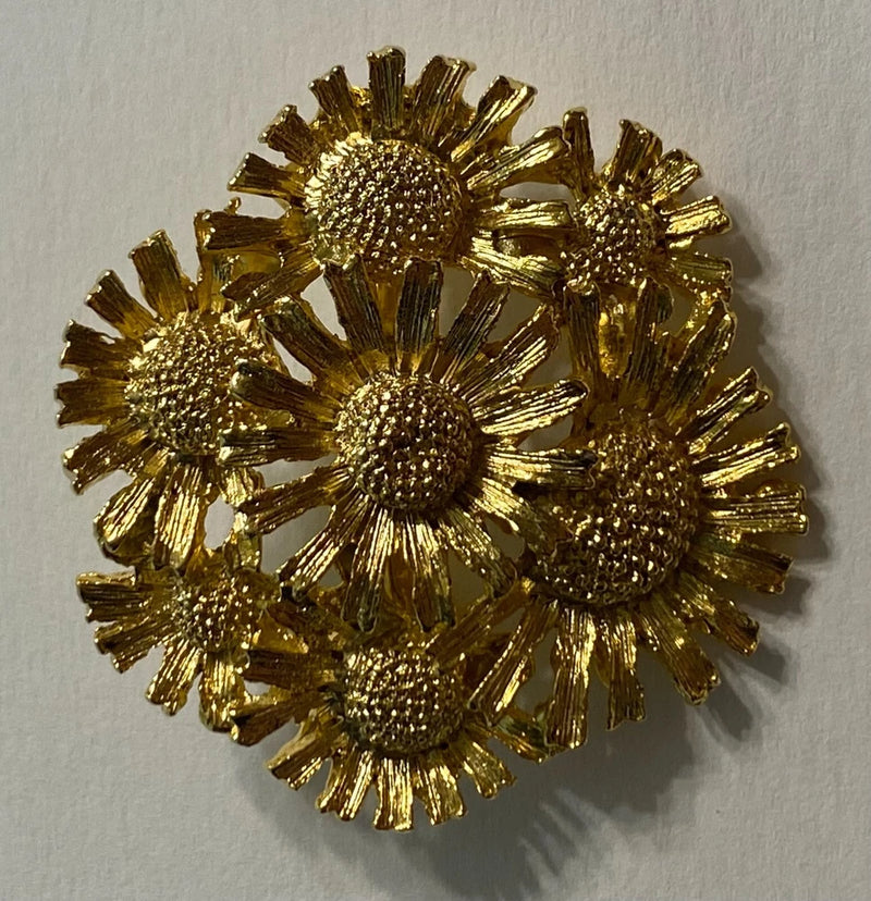 Gold-tone sunflower bouquet estate brooch pin with five raised sunflowers