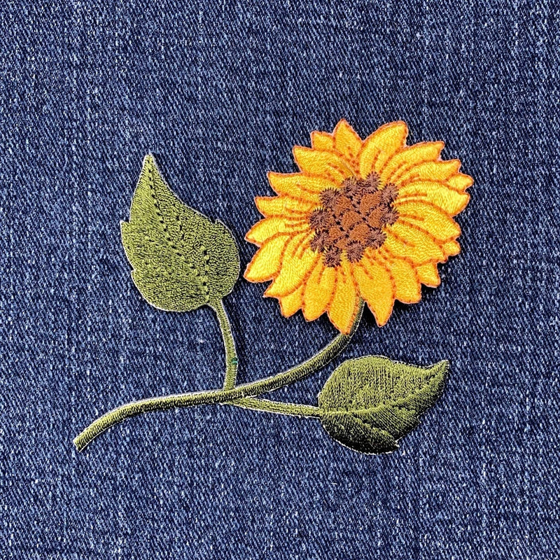 Sunflower applique patch with embroidered yellow-orange flower and green leaves