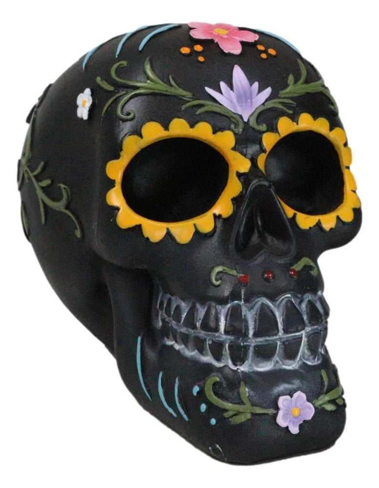 Black Day of the Dead sugar skull figurine with yellow sunflower eye circles and floral details