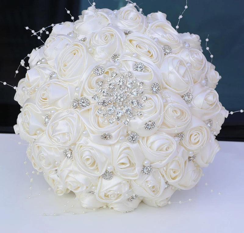 Ivory satin rose bridal bouquet with rhinestone brooch and pearl accents