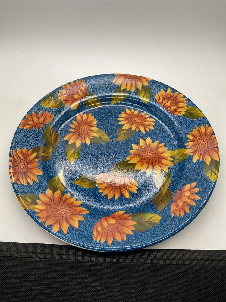 Blue dessert plate with orange sunflower pattern and white bird in center