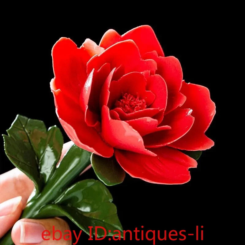 Red porcelain peony flower with green leaves