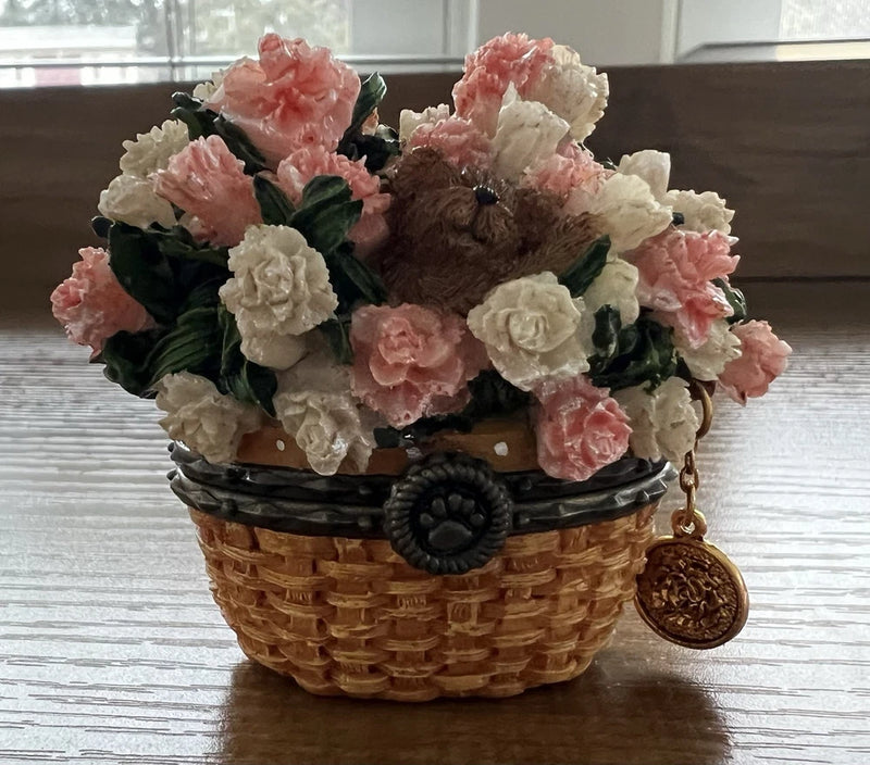 Bear-themed treasure box with faux carnations in a wicker basket and dangling charm