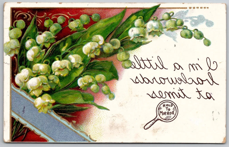 Embossed postcard with lily of the valley flowers and message, 'Hold to mirror' stamp