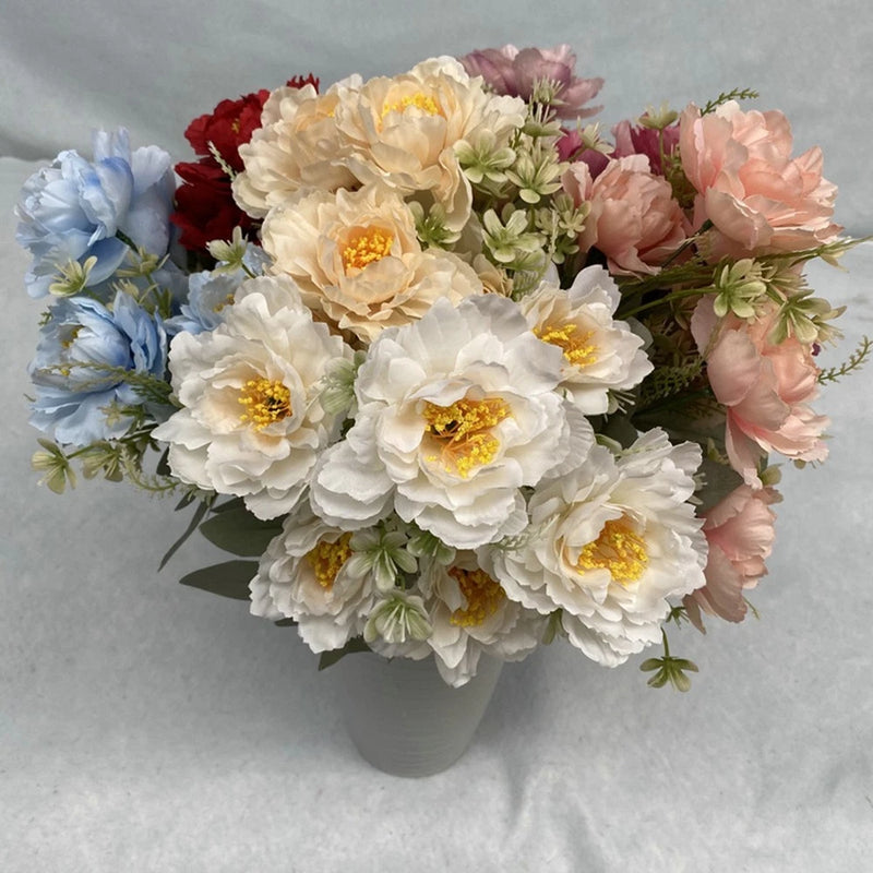 Silk peony bouquet with white, cream, blush pink, red, and pale blue peonies and greenery