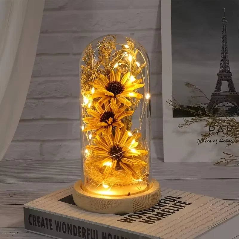 Sunflower glass dome LED light with glowing yellow flowers under clear dome