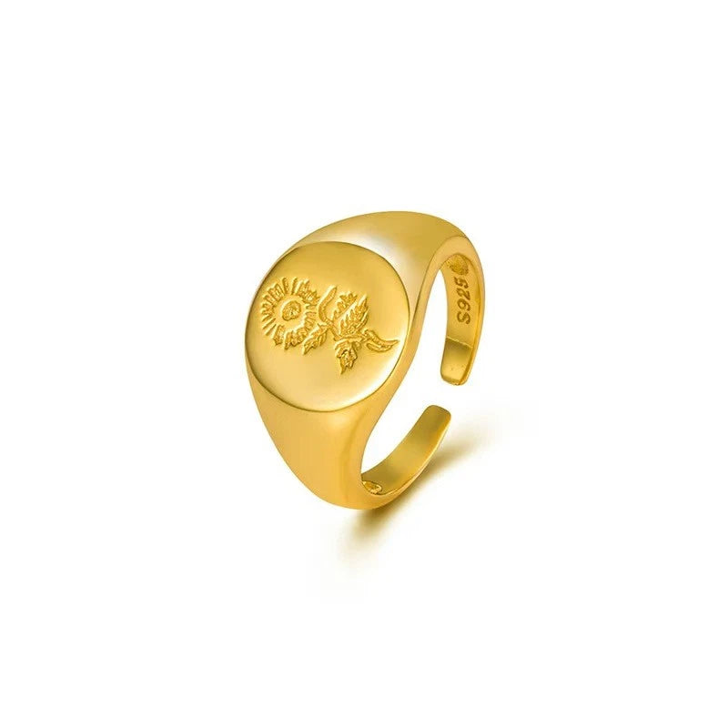 Gold-plated sterling silver ring with sunflower engraving on rounded band