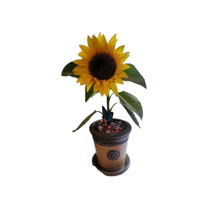 Yellow sunflower artificial potted plant with dark center and green leaves in small pot