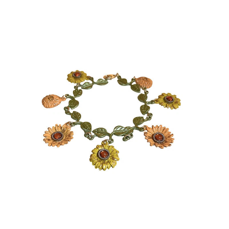 Sunflower leaf charm bracelet with five orange flower and brass-tone leaf links